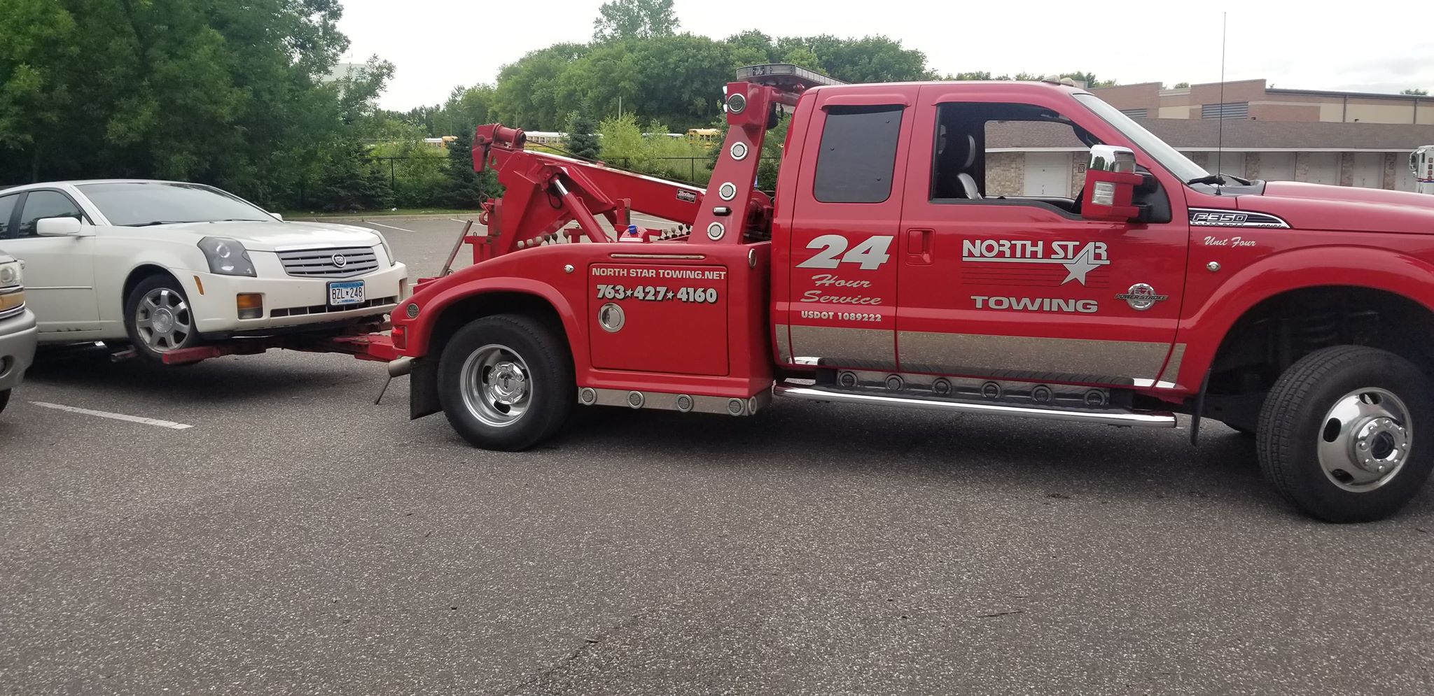 Cars being tow for parking during sweeping. UW Stout IREM Student Club